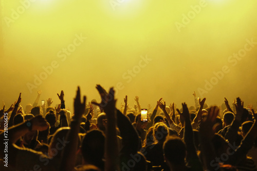crowd of people dancing at sunset