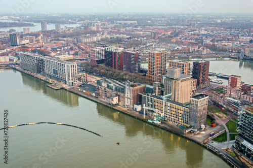 Rotterdam, The Netherlands, January 29, 2024: aerial view of Rijnhaven and Maashaven harbours with the neighbourhood of Katendrecht in between photo