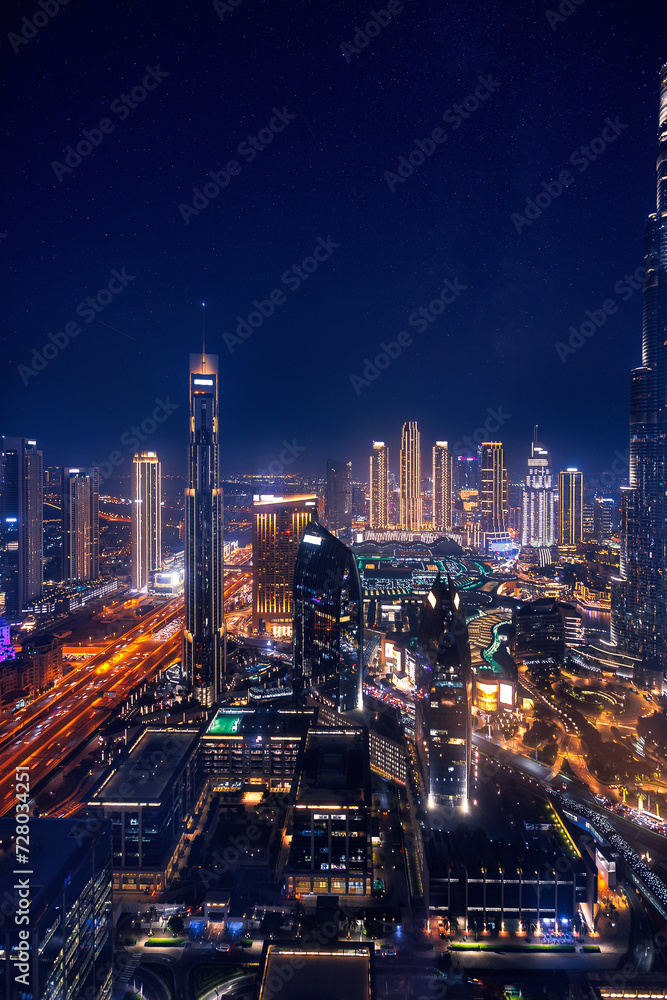 Modern downtown United Arab Emirates. Dubai night amazing skyline cityscape with illuminated skyscrapers, Aerial top view