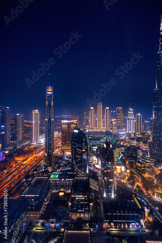Modern downtown United Arab Emirates. Dubai night amazing skyline cityscape with illuminated skyscrapers, Aerial top view photo