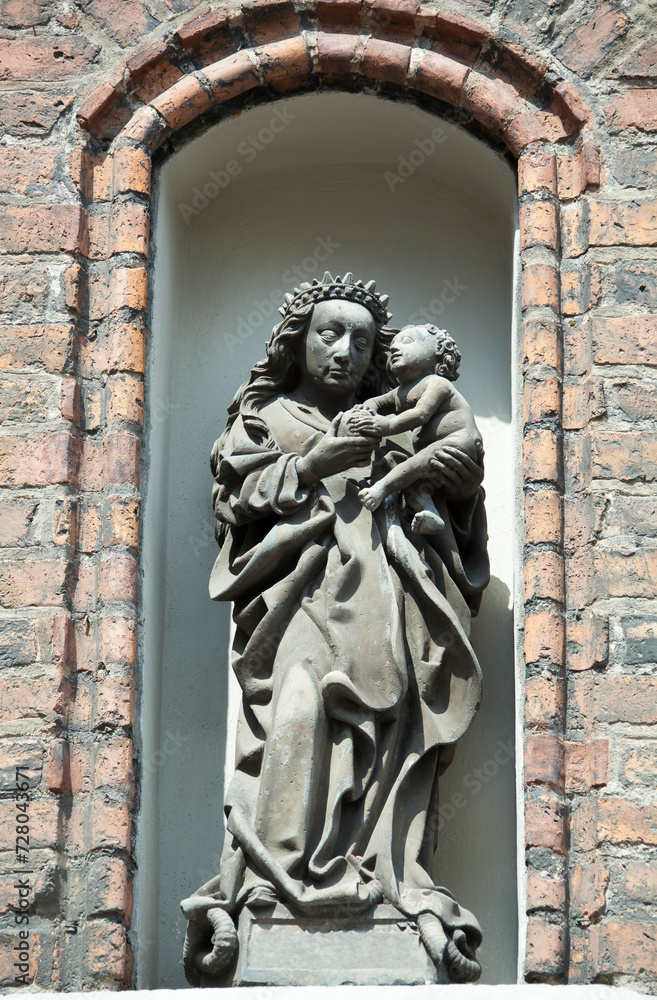 Gdansk Old Town Gothic Church Exterior With A Religious Sculpture