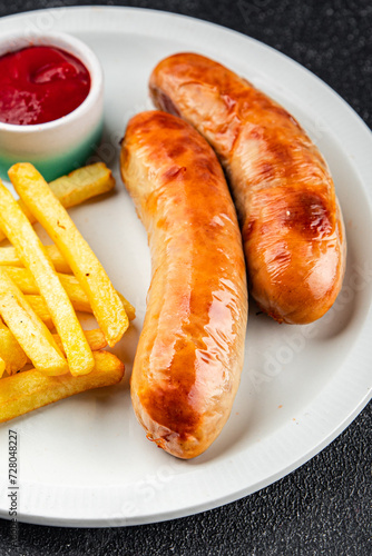 sausage french fries fast food fried meat and potatoes tasty fresh eating cooking meal food snack on the table copy space food background rustic top view