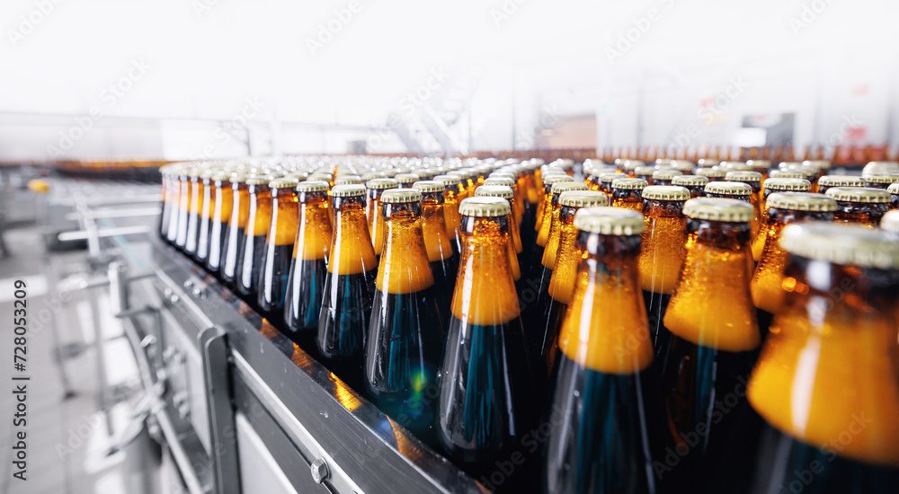 Banner Beer brewery conveyor. Brown glass alcohol bottles move on production line, modern equipment industrial drink with copy space - obrazy, fototapety, plakaty 