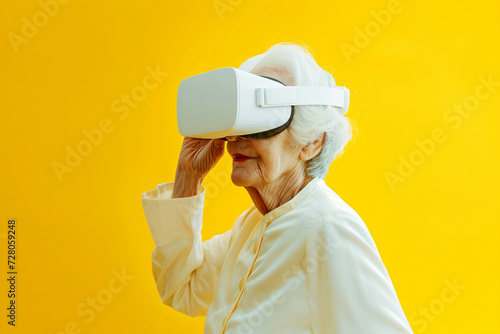 old woman with VR glasses isolated on yellow background with copy space