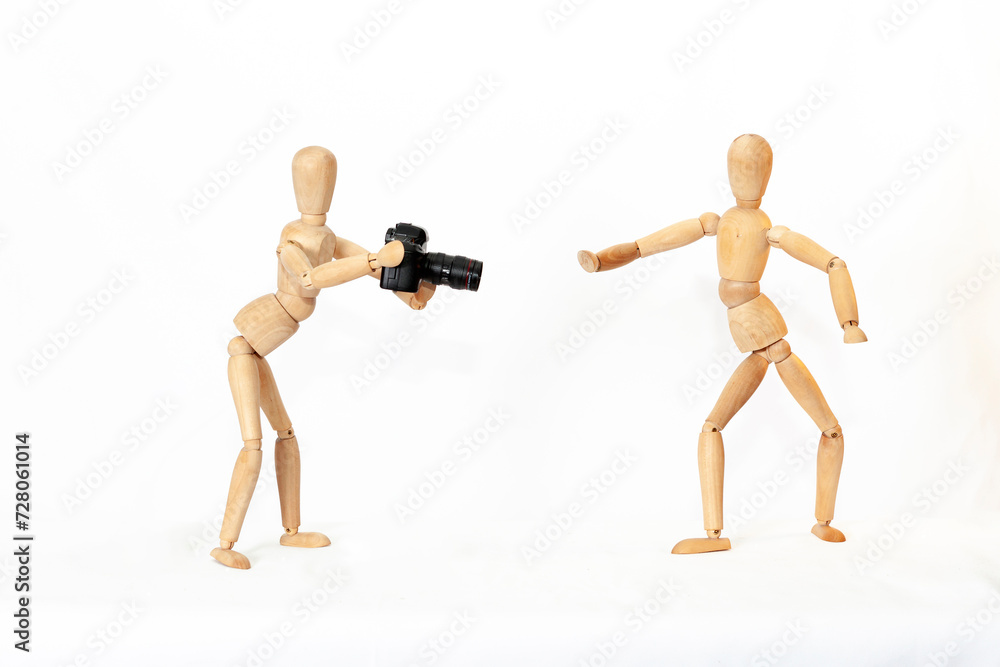 Wooden figure of a mannequin with a camera on a white isolated background...
Wooden figure of a mannequin with a camera on a white isolated background...