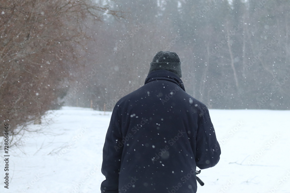 couple walking in the snow couple walking in the snow