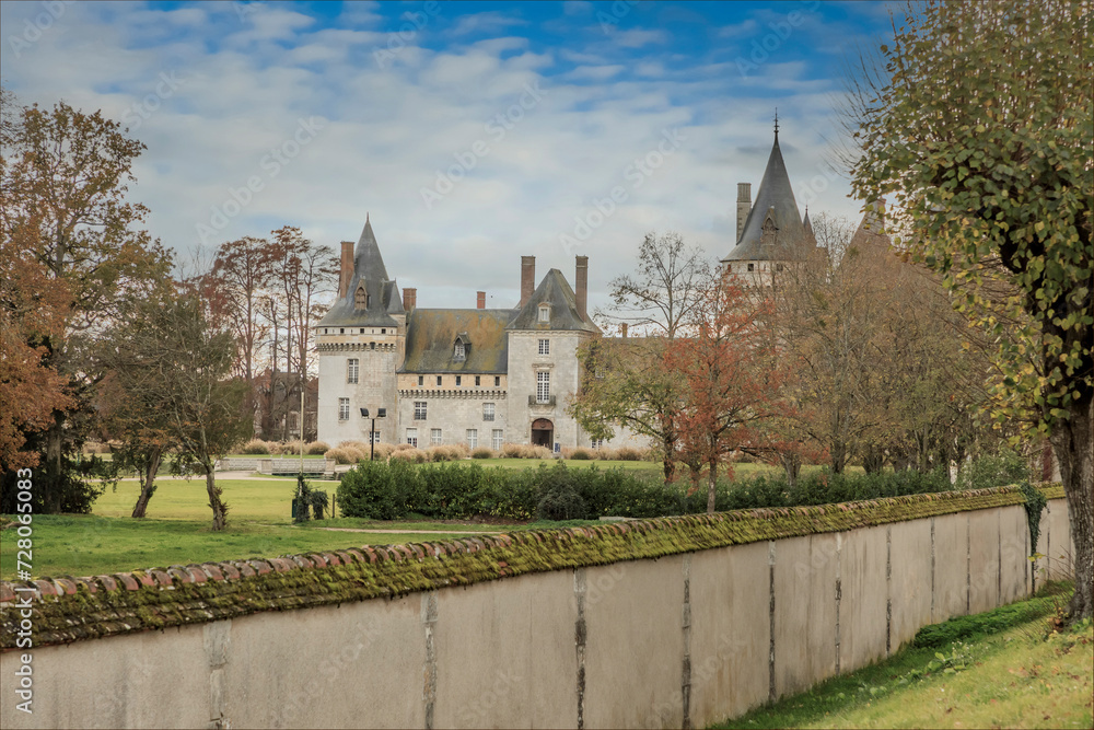 Looking over a wall at a french castle in the distance