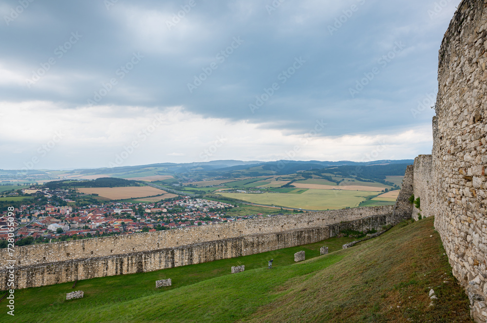 Surrounding wall of Spiss castle with view of the town Spišský Hrhov, Slovakia below