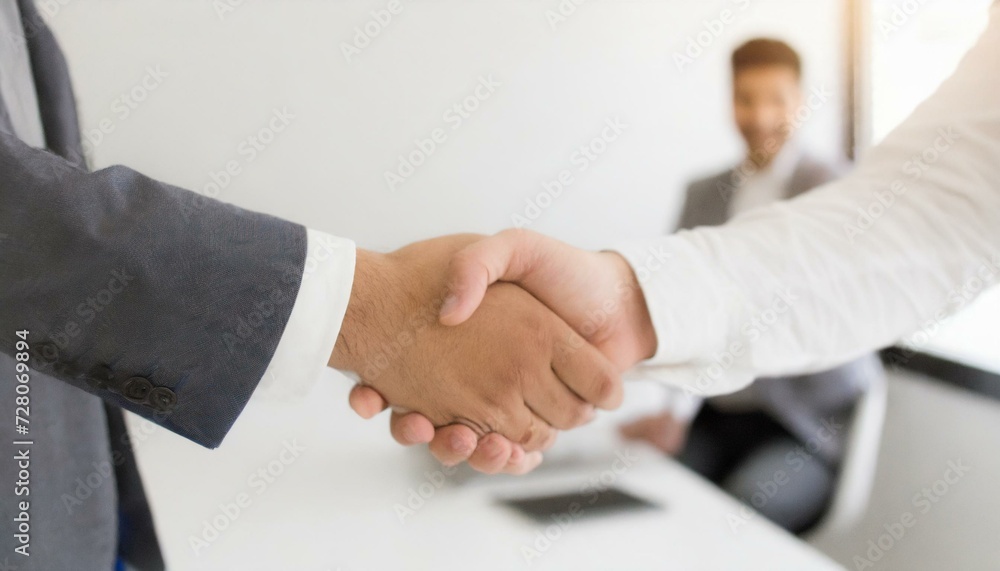 close up of hand shaking business men