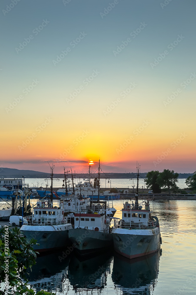 Three fishing vessels anchored at the port in Sozopol
