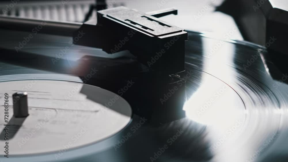Vintage vinyl record rotates on the retro turntable, needle touches the