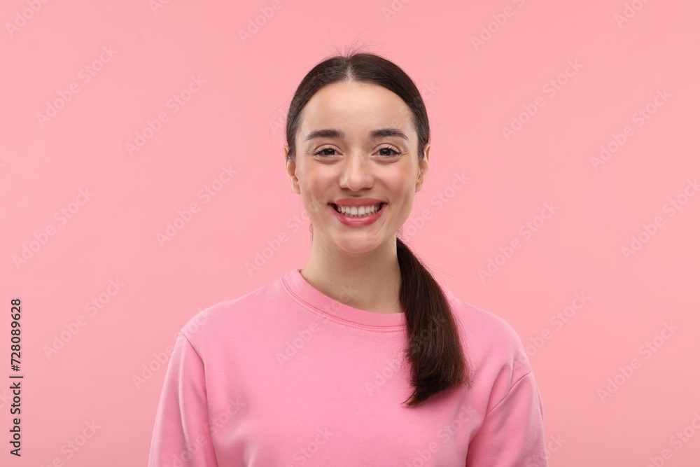 Beautiful woman with clean teeth smiling on pink background Beautiful woman with clean teeth smiling on pink background
