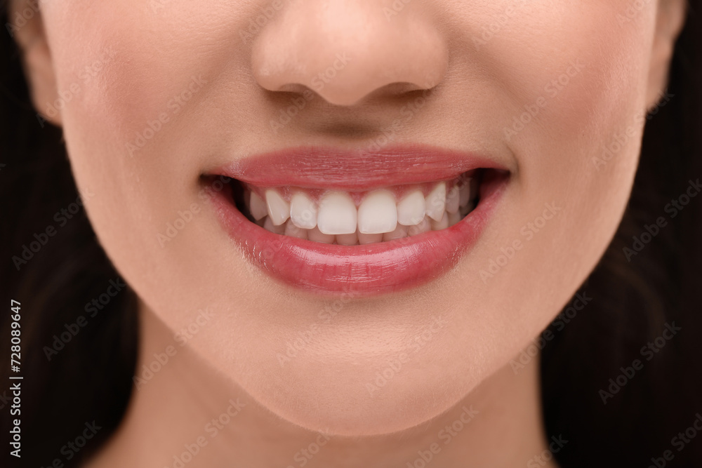 Woman with clean teeth smiling, closeup view Woman with clean teeth smiling, closeup view