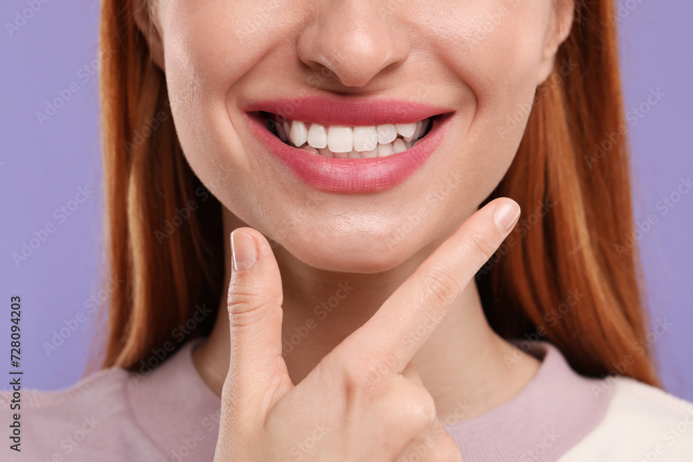 Woman with clean teeth smiling on violet background, closeup Woman with clean teeth smiling on violet background, closeup