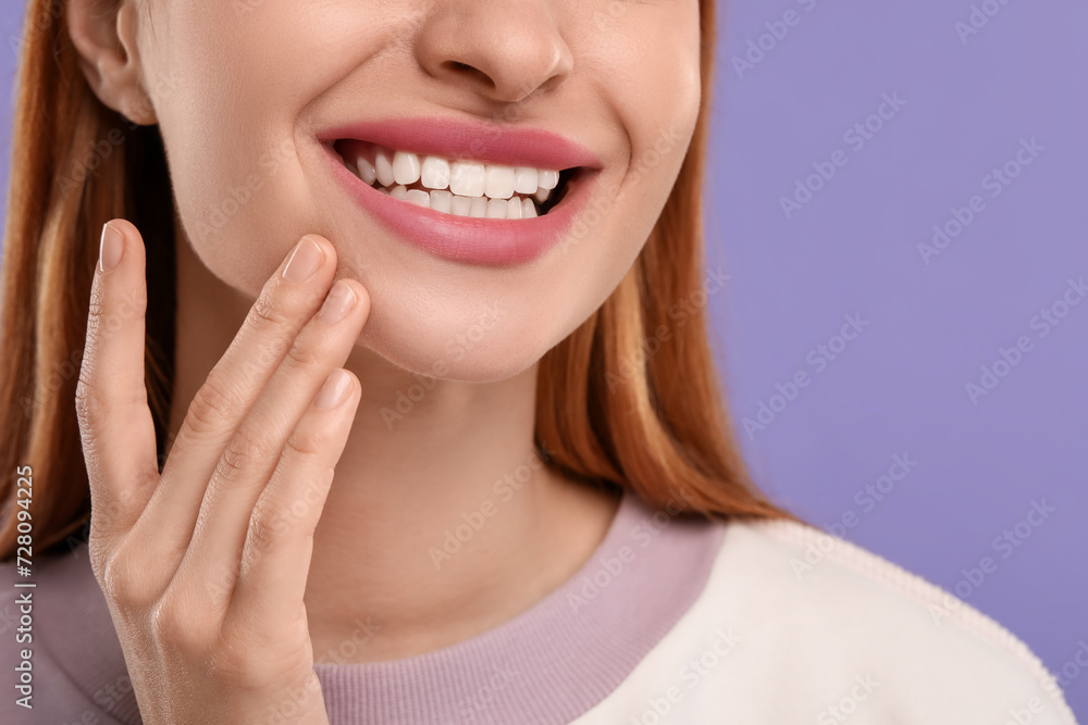 Woman with clean teeth smiling on violet background, closeup. Space for text Woman with clean teeth smiling on violet background, closeup. Space for text