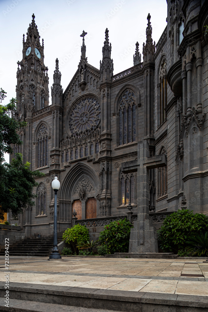 Arucas, Las Palmas, Gran Canaria: Wide View of San Juan Bautista Church, Neo-Gothic Marvel in Spain. Vertical View Showcases Architectural Elegance and Cultural Richness for Captivating Travel Scenes.