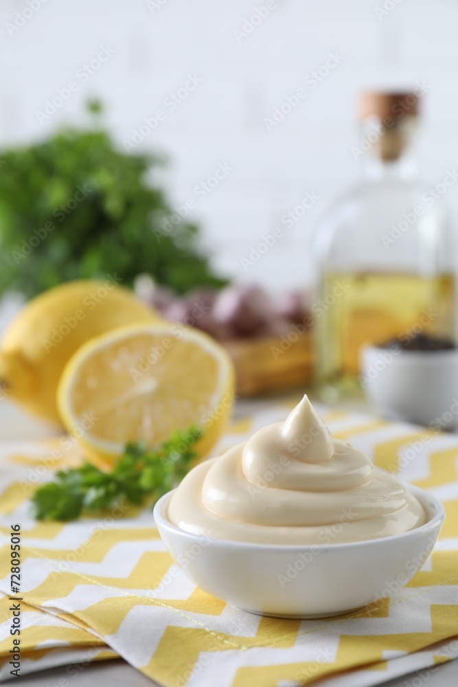 Tasty mayonnaise sauce in bowl on table. Space for text Tasty mayonnaise sauce in bowl on table. Space for text
