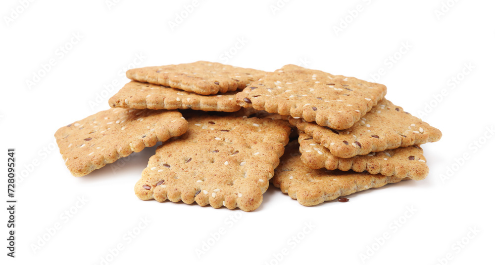 Pile of cereal crackers with flax and sesame seeds isolated on white