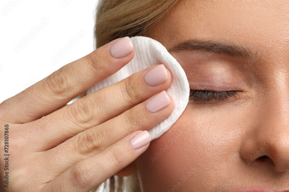 Woman removing makeup with cotton pad on white background, closeup Woman removing makeup with cotton pad on white background, closeup