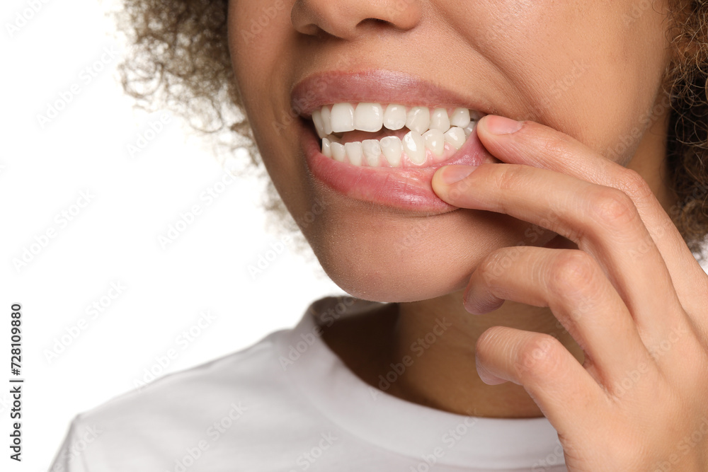 Woman showing her clean teeth on white background, closeup Woman showing her clean teeth on white background, closeup