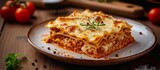 Delicious Italian Past on a Plate: Indulge in Mouthwatering Lasagna, the Classic Italian Pasta Dish Served on a Traditional Plate