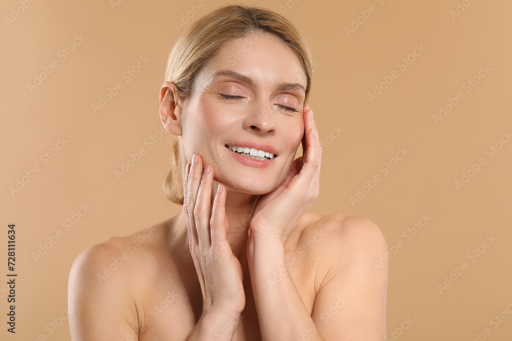 Beautiful woman with healthy skin on beige background Beautiful woman with healthy skin on beige background