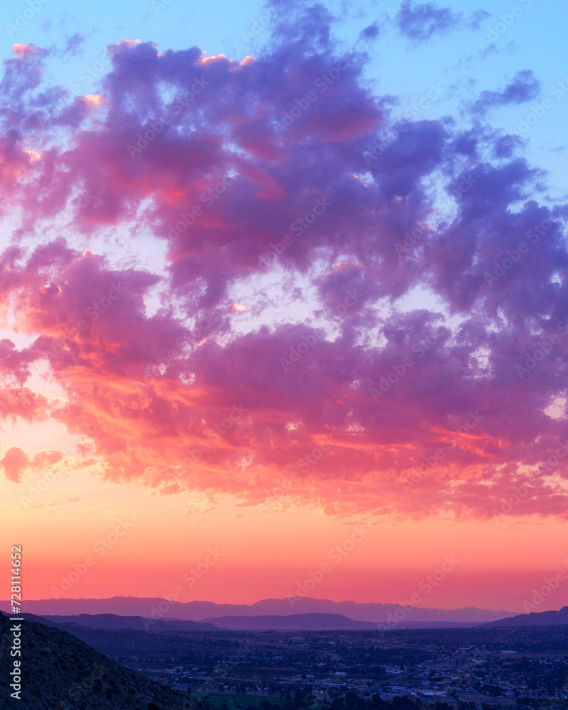 Colorful pink, orange, and purple sunrise and clouds view