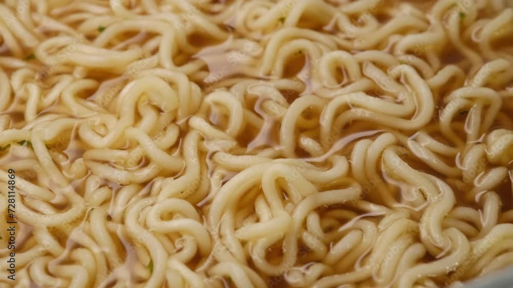 golden tortilla in a wooden plate and Chinese chopsticks. Asian noodles close up golden tortilla in a wooden plate and Chinese chopsticks. Asian noodles close up