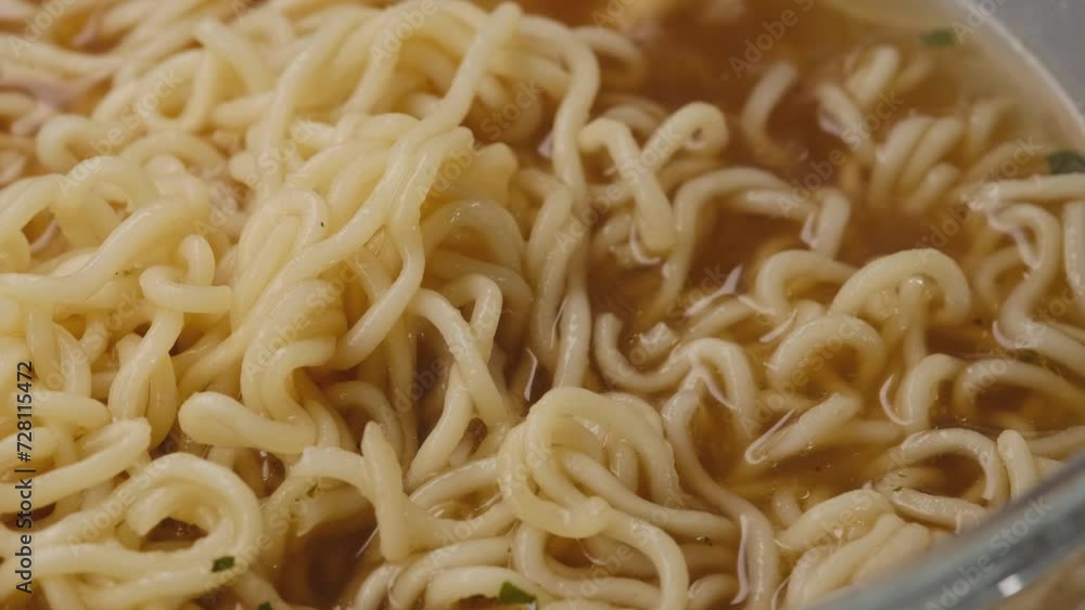 golden tortilla in a wooden plate and Chinese chopsticks. Asian noodles close up golden tortilla in a wooden plate and Chinese chopsticks. Asian noodles close up