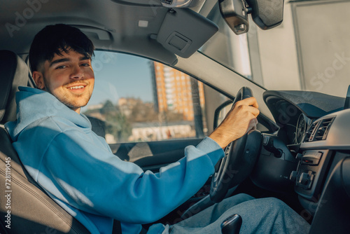 novice or young driver driving in the car