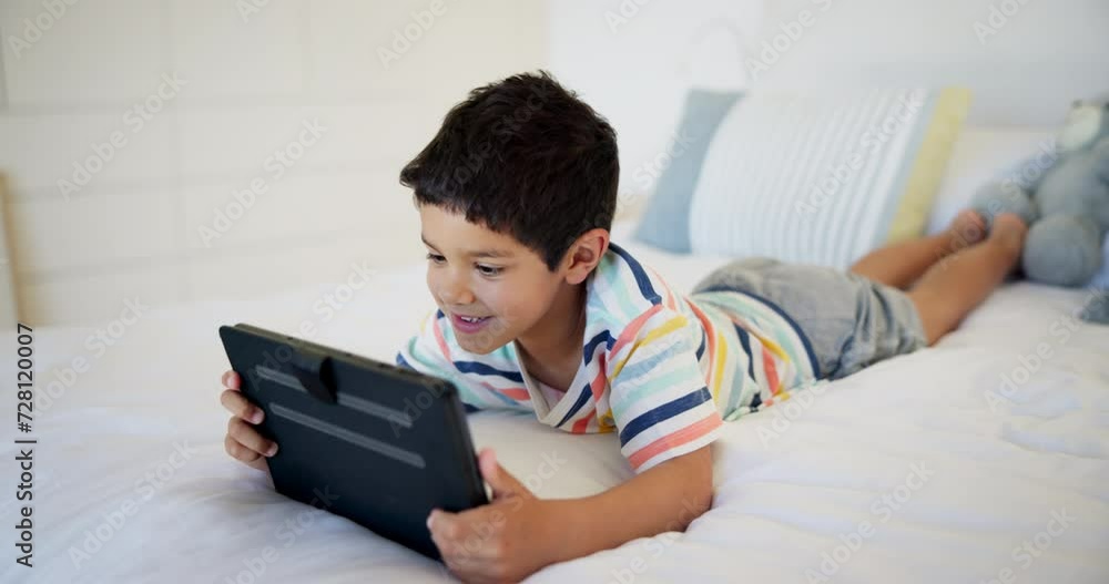 Bed, smile and boy with a tablet, typing or connection for online gaming or digital app for learning. Kid, apartment or child development with tech or home with social media and happy with cartoon Bed, smile and boy with a tablet, typing or connection for online gaming or digital app for learning. Kid, apartment or child development with tech or home with social media and happy with cartoon