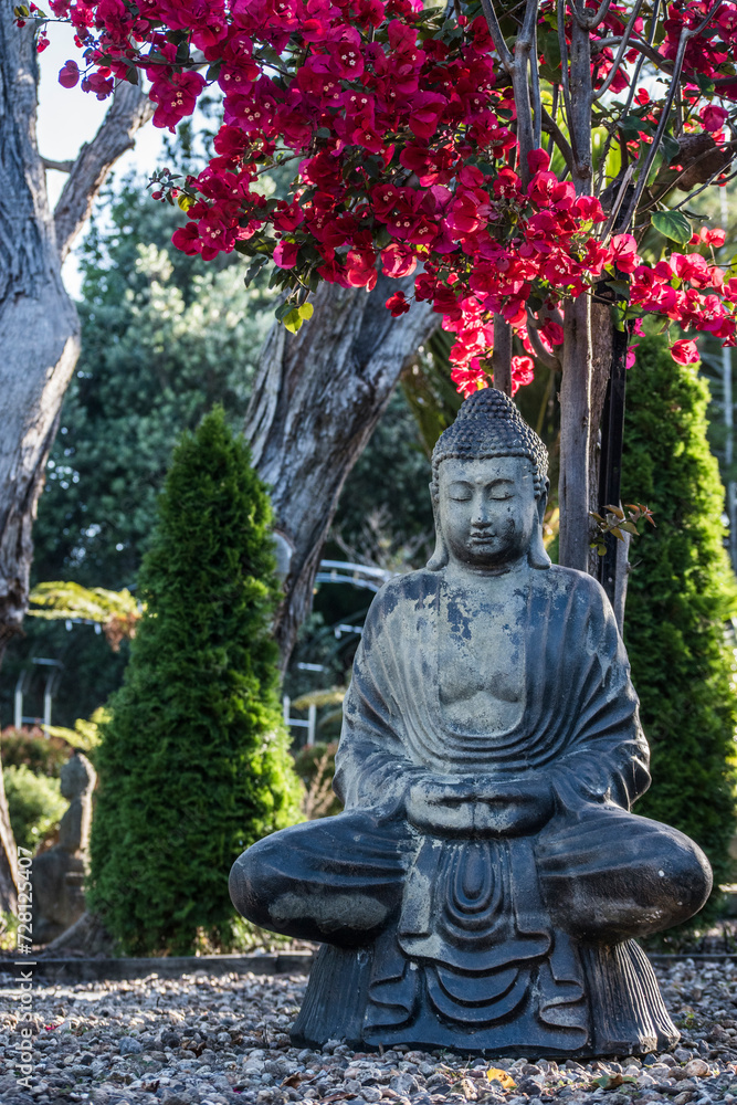Buddha in the blossoming garden Buddha in the blossoming garden