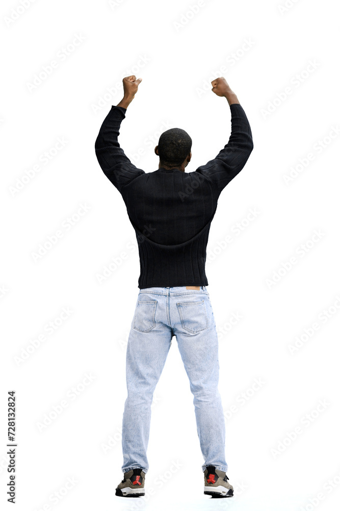 A man, full-length, on a white background, raised his hands up
