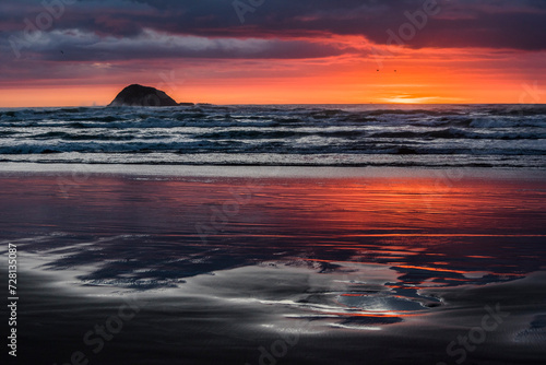 Sunset at the beach with reflection of colorful light