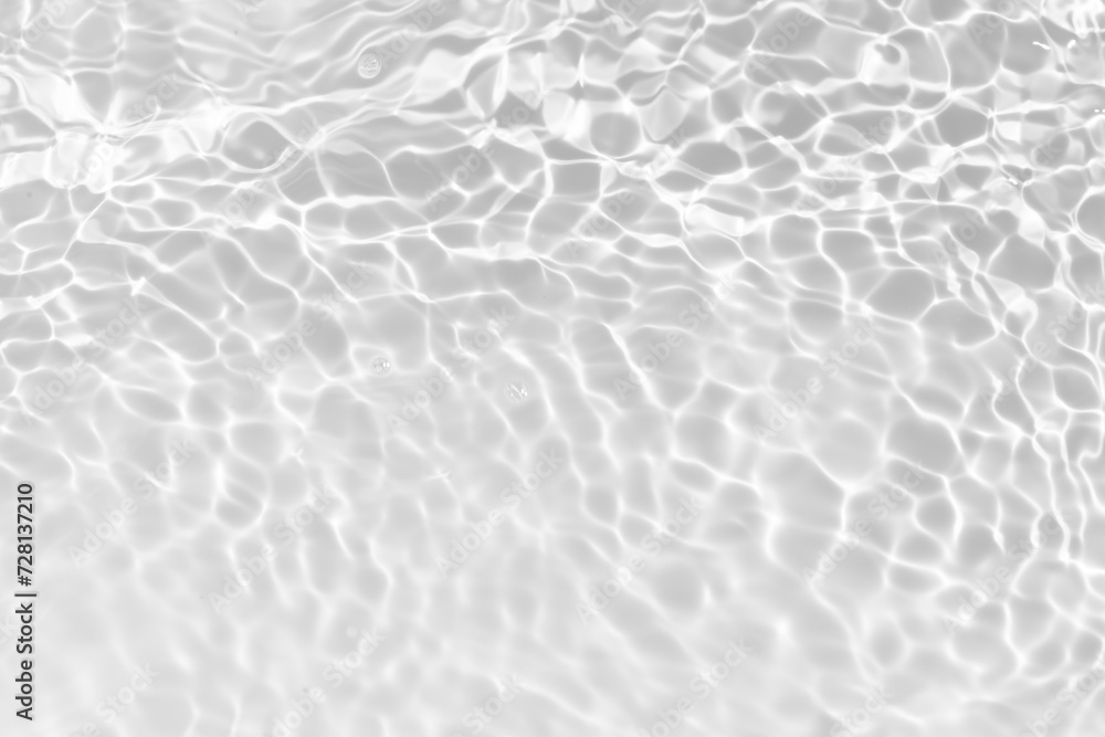 White water with ripples on the surface. Defocus blurred transparent white colored clear calm water surface texture with splashes and bubbles. Water waves with shining pattern texture background. White water with ripples on the surface. Defocus blurred transparent white colored clear calm water surface texture with splashes and bubbles. Water waves with shining pattern texture background.