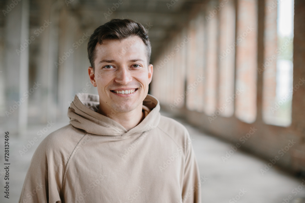 Portrait of a young man on an urban background. Portrait of a young man on an urban background.