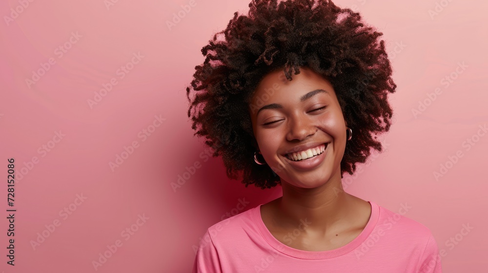 Smiling young African American woman on pink Smiling young African American woman on pink