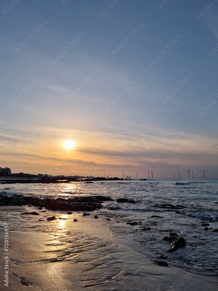 This is the sunset view of Gwakji Beach in Jeju Island.