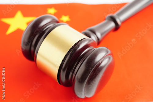 China law, Legal, justice and agreement, wooden court gavel on flag.