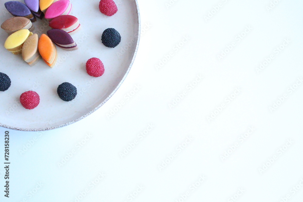 Rainbow candies with raspberries Rainbow candies with raspberries