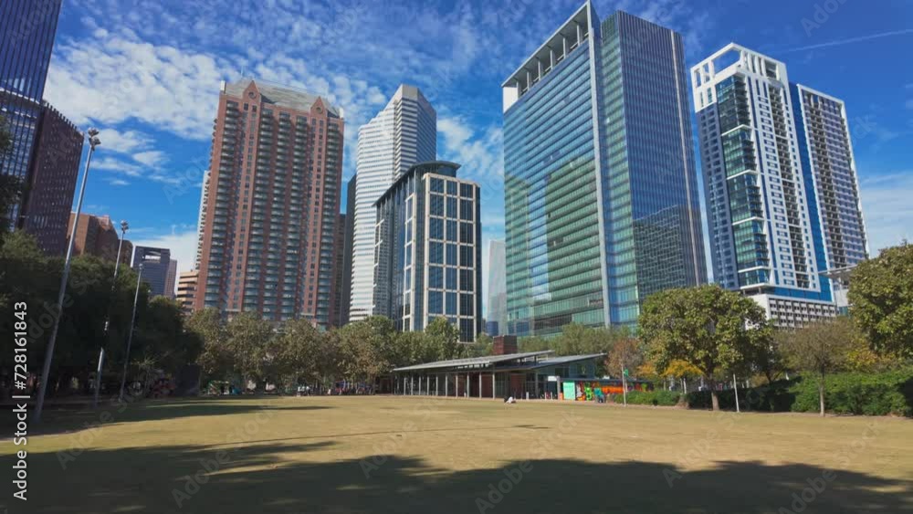 Open grass area in Discovery Green park in Houston on a sunny day Open grass area in Discovery Green park in Houston on a sunny day