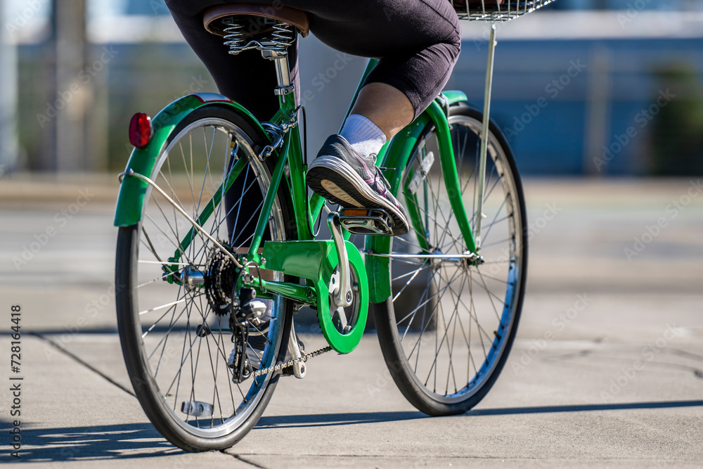Naklejka premium Plus size woman prefers cycling to lose weight and burn excess body fat and improve health