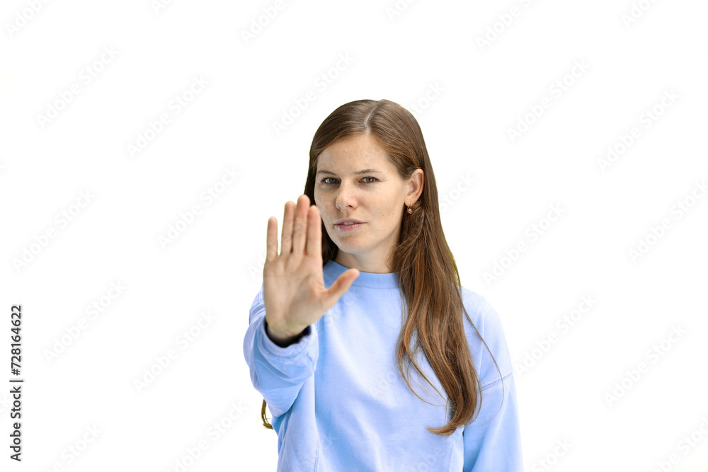 A woman, close-up, on a white background, shows a stop sign A woman, close-up, on a white background, shows a stop sign