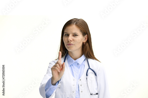 Female doctor  close-up  on a white background  shows an important sign