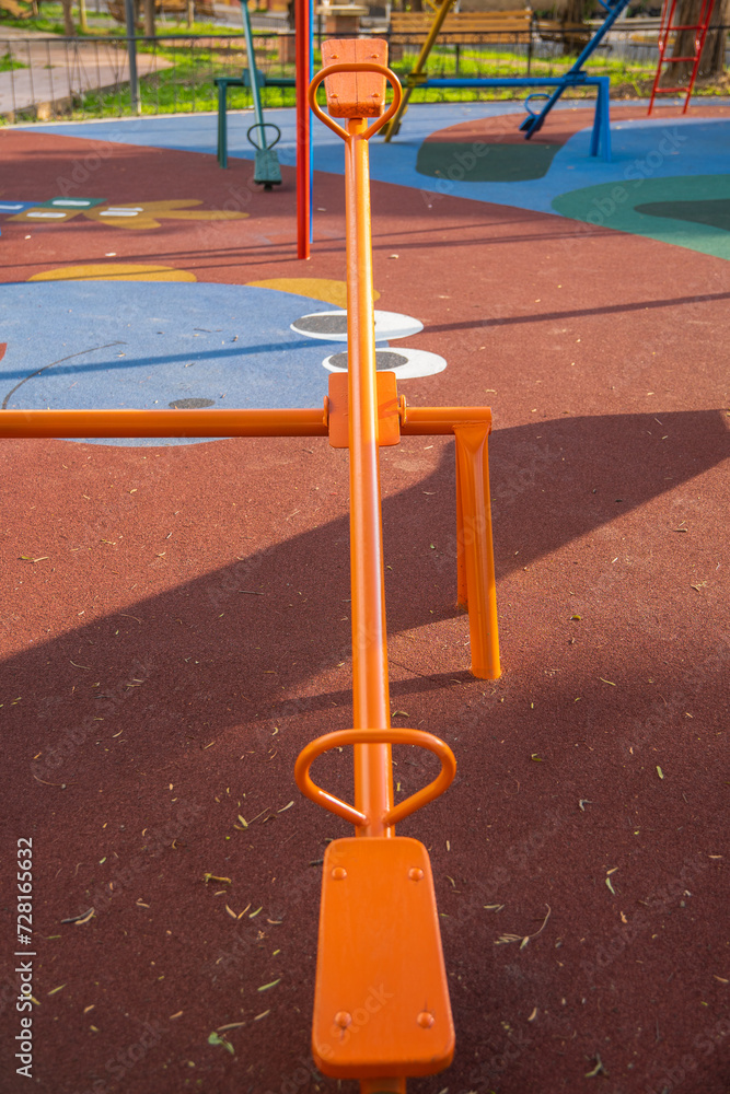 Fototapeta premium perspective of a colorful seesaw on a children's playground