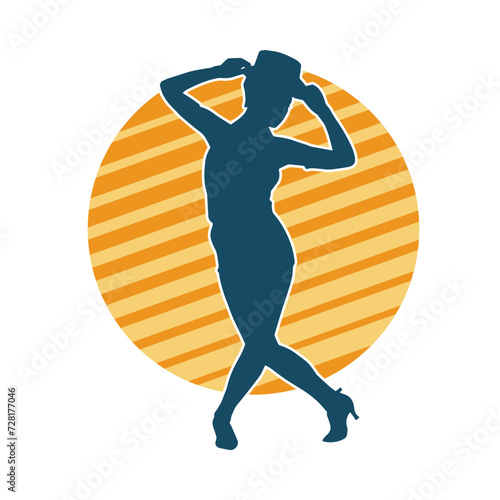 Silhouette of a female dancer in action pose. Silhouette of a woman dancing happily.