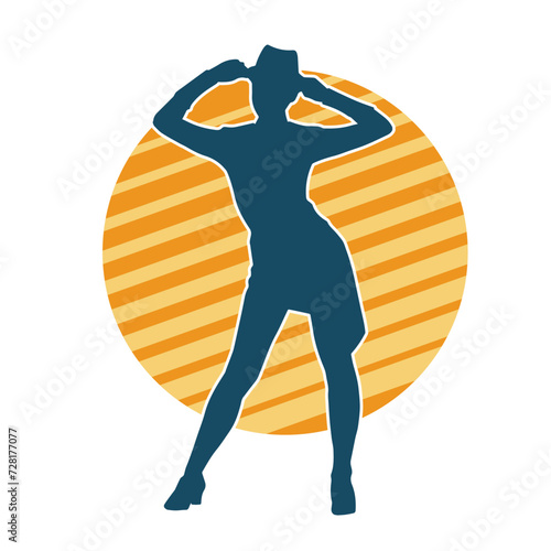 Silhouette of a female dancer in action pose. Silhouette of a woman dancing happily.