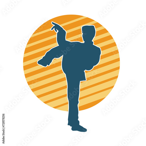 Silhouette of a man in oriental martial art pose. Silhouette of a male in martial art move.