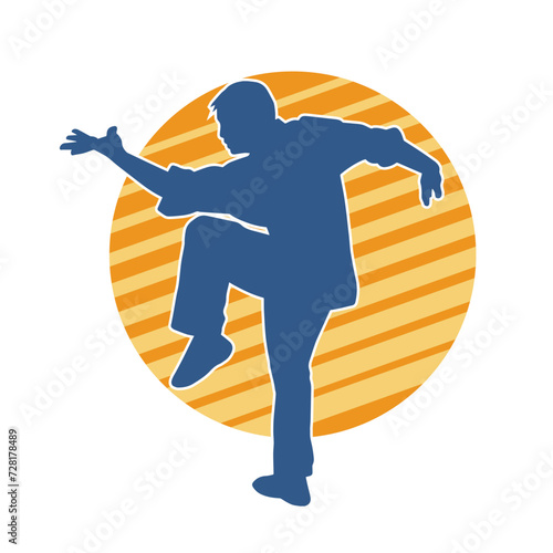 Silhouette of a man in oriental martial art pose. Silhouette of a male in martial art move.