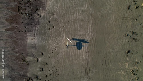 A Pair of surfers walking on the beach